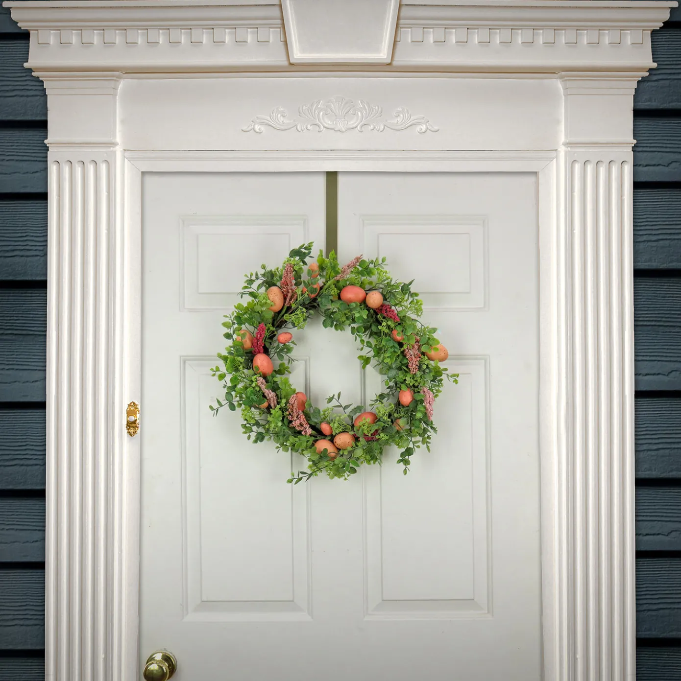 22 in. Easter Wreath Decorated with Pink Pastel Eggs, Pink Flowers, Leafy Greens